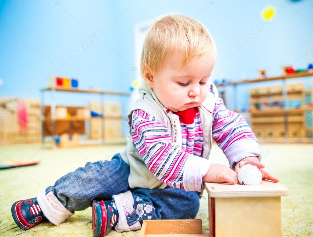 little girl in the classroom early development