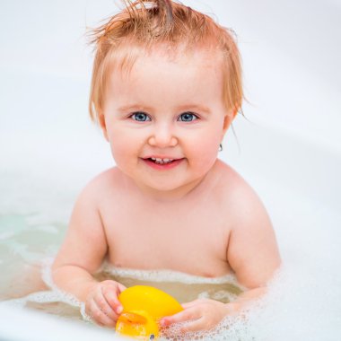 cute 1 year-old girl bathes clipart