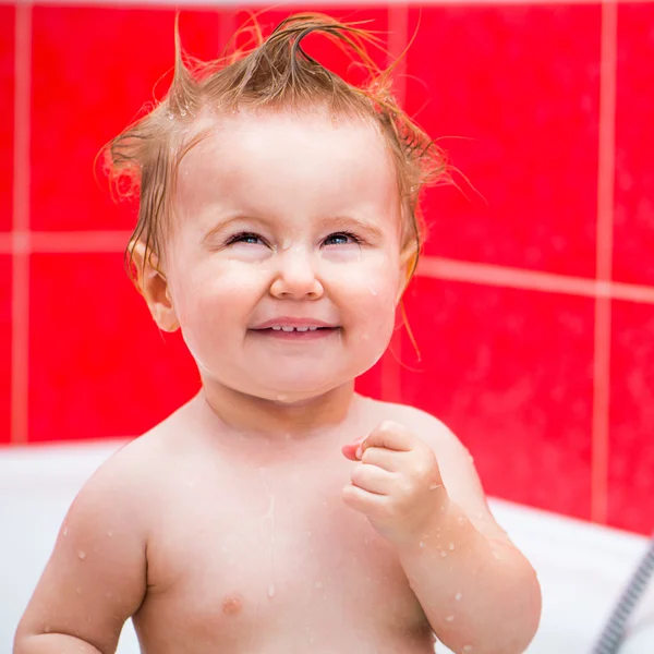 Cute 1 year-old girl bathes — Stock Photo, Image