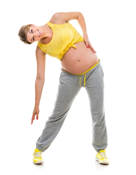 Gravid kvinna bedriver fitness — Stockfoto