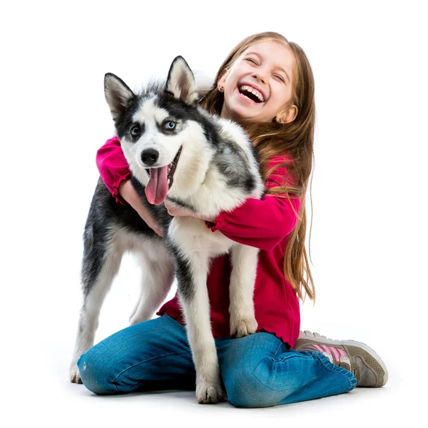 Meisje met husky hond — Stockfoto