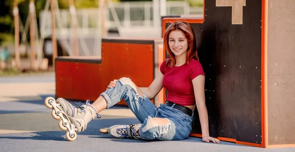 Girl with roller skates outdoors — Stock Photo, Image