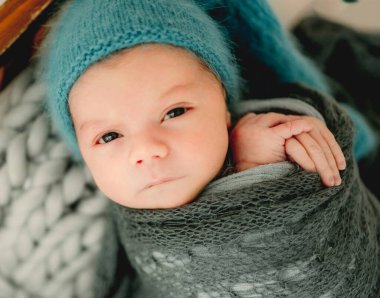 Newborn baby boy studio portrait
