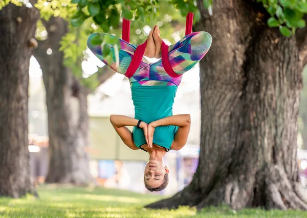 Girl doing fly yoga — Stock Photo, Image