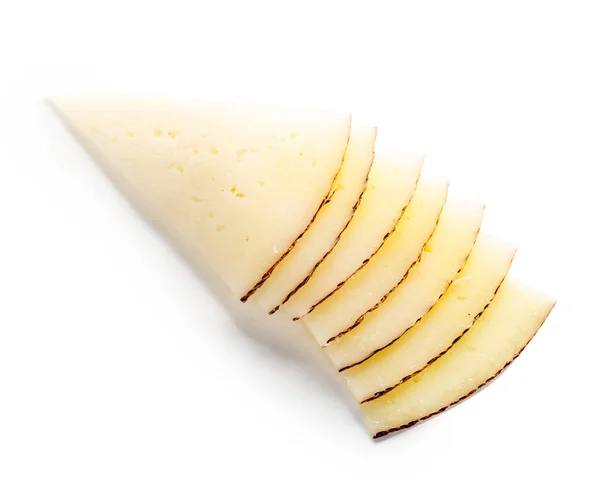 Pedaço de queijo cheddar em um branco — Fotografia de Stock
