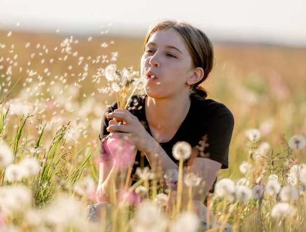 Pretty Girl Teenager Sitting Field Blows Dandelions Outdoors Beautiful Young — Stock Photo, Image