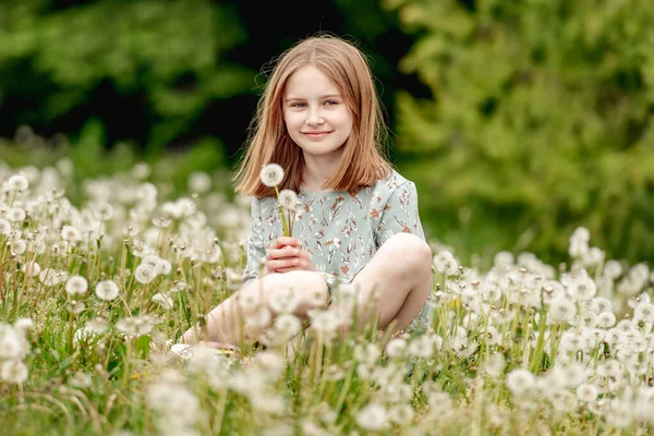 Little Girl Holding White Blowballs Flower Hands Looking Camera Blossom — стоковое фото