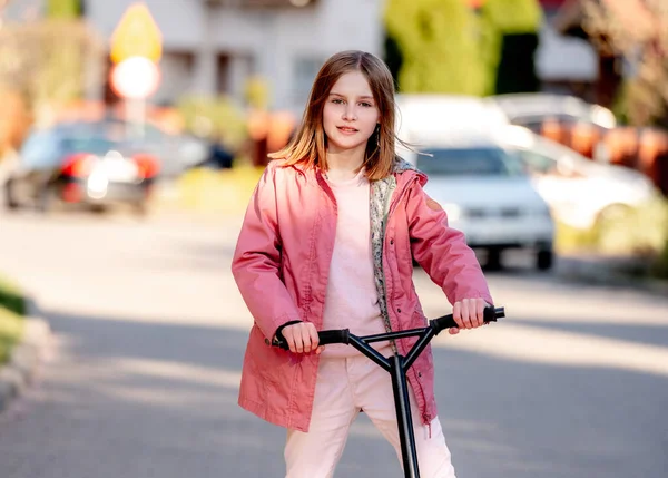 Cute Little Girl Rides Kick Scooter Street Home — Foto Stock