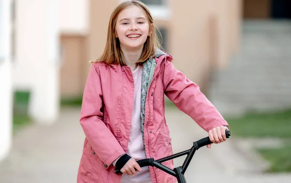 Smilling Little Girl Rides Kick Scooter Street Home — Foto Stock