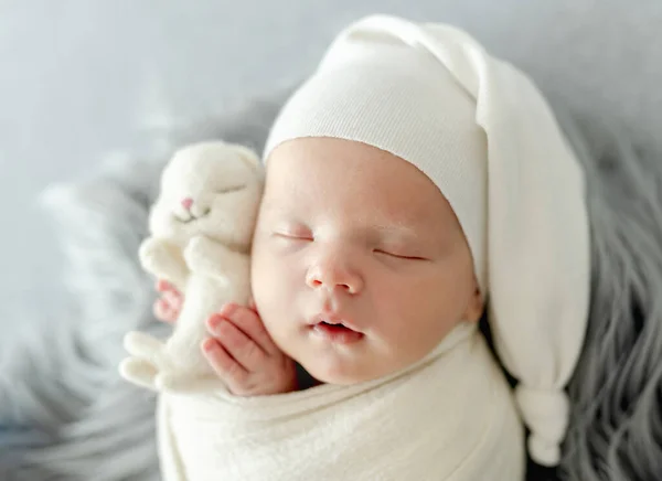 Newborn Baby Child Swaddled Fabric Sleeping Holding Bunny Toy Sweet — Zdjęcie stockowe