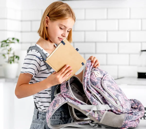 Preteen Girl Preparing Backpack School Class Lessons Home Put Notebook — Foto de Stock