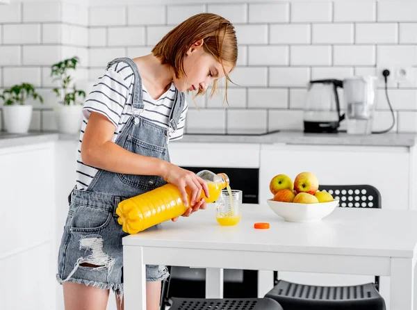Preteen Girl Pours Orange Juice Bottle Glass Kitchen Pretty Child — Photo
