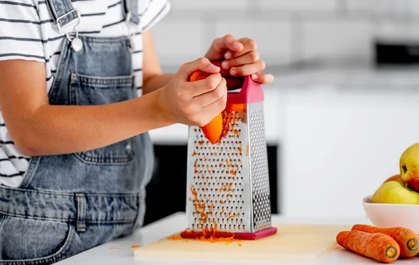 Girl Child Hands Grinds Carrot Using Grater Kitchen Closeup Pretty — Stok fotoğraf