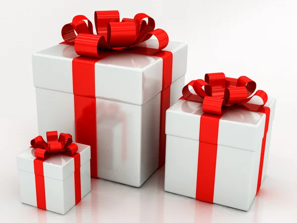 Caixas de presente branco com fita vermelha — Fotografia de Stock
