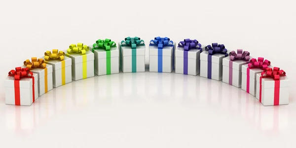 White gift boxes with varicolored ribbon — Stock Photo, Image