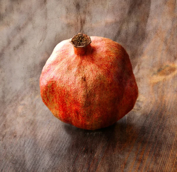 Vintage background with old dry pomegranate — Stock Photo, Image