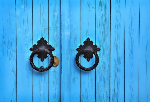 Blue wooden door with round handles — Stock Photo, Image