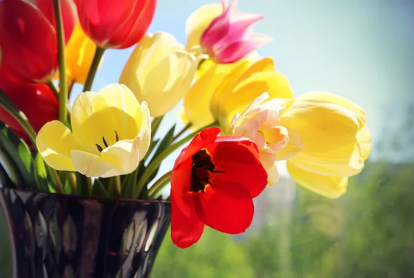 Bouquet of colorful spring tulips in a vase — Stock Photo, Image