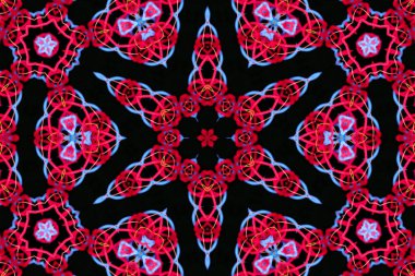 Siyah bir arkaplanda parlak renkli ipliklerin soyut deseni