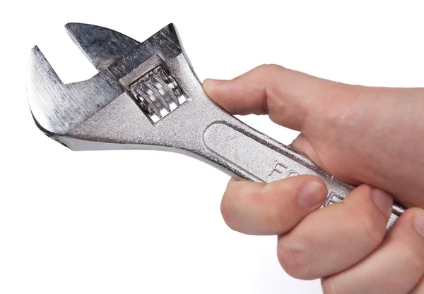 Steel wrench in hand — Stock Photo, Image