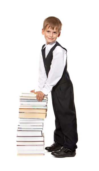 Мальчик и книги. Возвращение в школу — стоковое фото