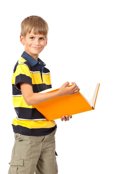 Schuljunge hält ein Buch in der Hand. Zurück zur Schule — Stockfoto