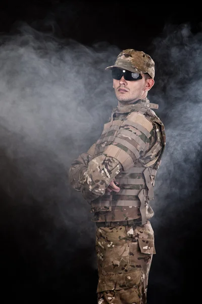 Military man on a black background — Stock Photo, Image