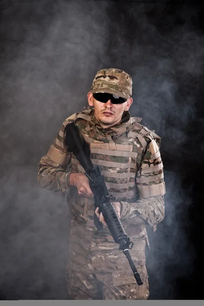 Modern soldier with rifle — Stock Photo, Image