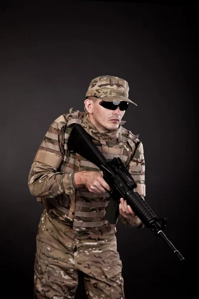 Modern soldier with rifle — Stock Photo, Image