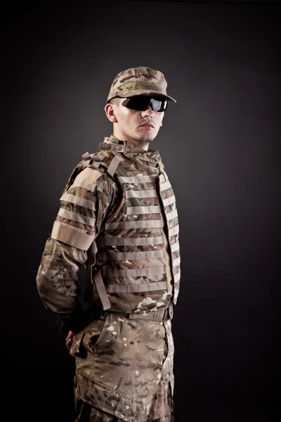 Military man on a black background — Stock Photo, Image