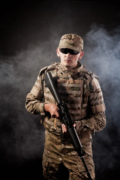 Modern soldier with rifle — Stock Photo, Image