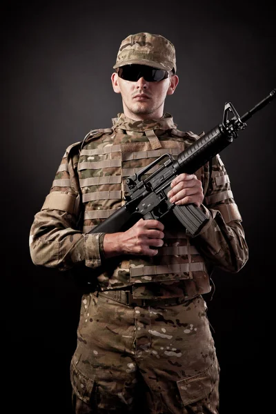 Modern soldier with rifle — Stock Photo, Image