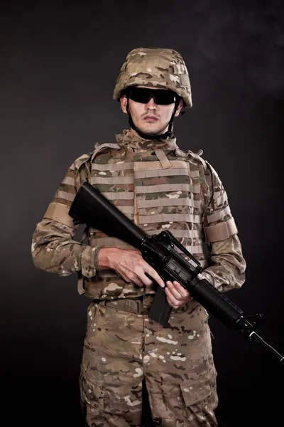 Modern soldier with rifle — Stock Photo, Image