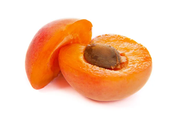 Two ripe apricot sectioned by knife — Stock Photo, Image