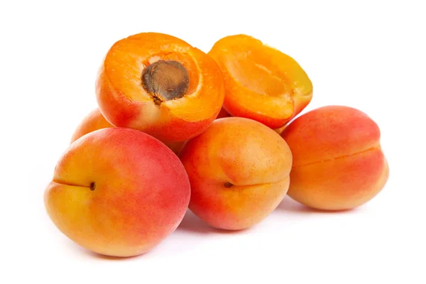 Group of ripe apricots with a half — Stock Photo, Image