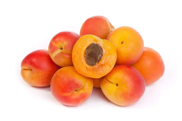 Group of ripe apricots with a half — Stock Photo, Image