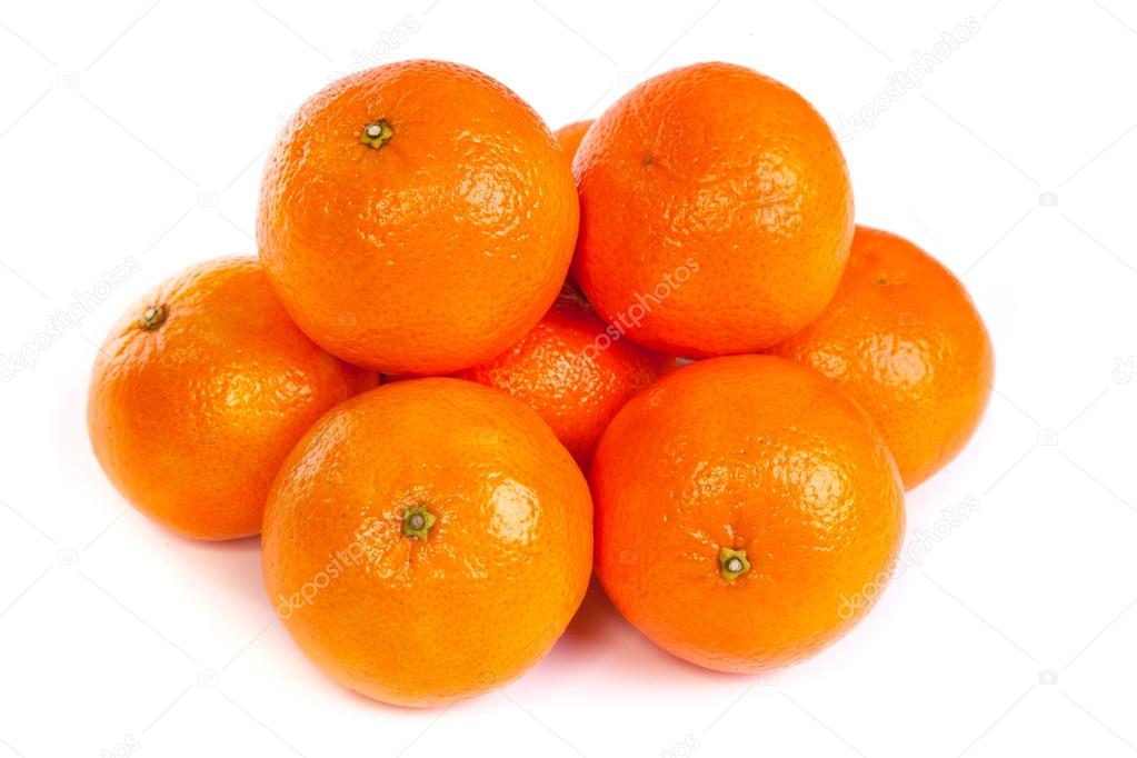 Group of ripe tangerine or mandarin with slices on white