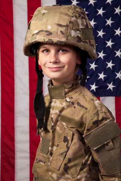 Boy USA soldier in front of American flag. — Stock Photo, Image