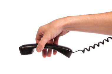 eski bir siyah telefon tüpü tutan el