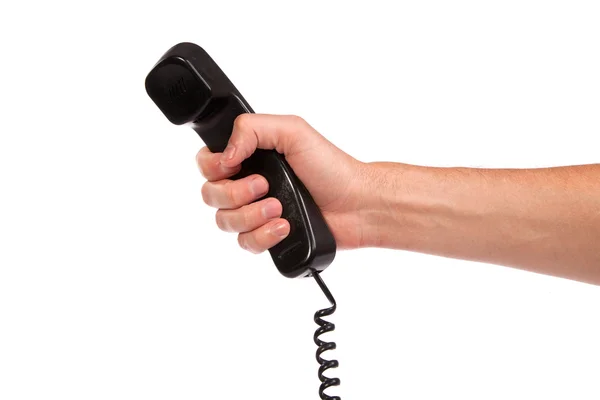 Hand hält einen alten schwarzen Telefonschlauch — Stockfoto