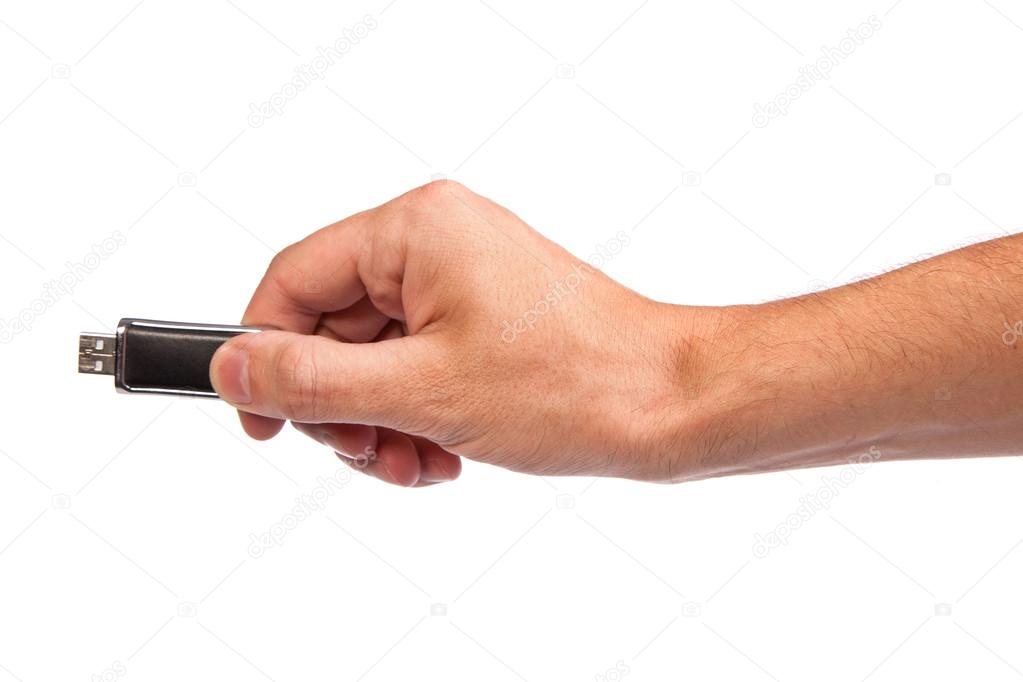 Closeup image: hand holding black USB data storage or connecting