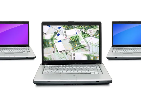 Laptops abertos com dinheiro — Fotografia de Stock