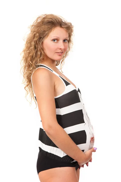 妊娠中の女性は彼女の腹を愛撫します。 — ストック写真