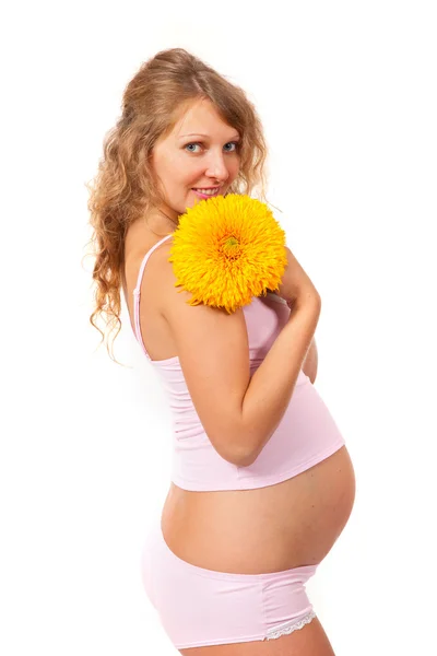 Pregnant woman is caressing her belly — Stock Photo, Image