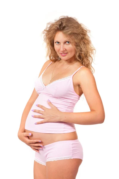 Pregnant woman is caressing her belly — Stock Photo, Image