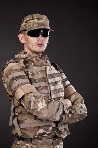 Military man on a black background — Stock Photo, Image