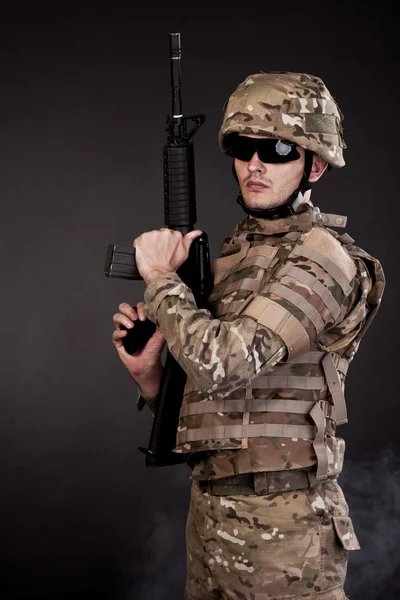 Modern soldier with rifle — Stock Photo, Image