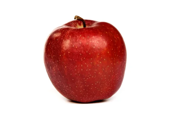 Ein leuchtend roter Apfel isoliert auf weiß — Stockfoto