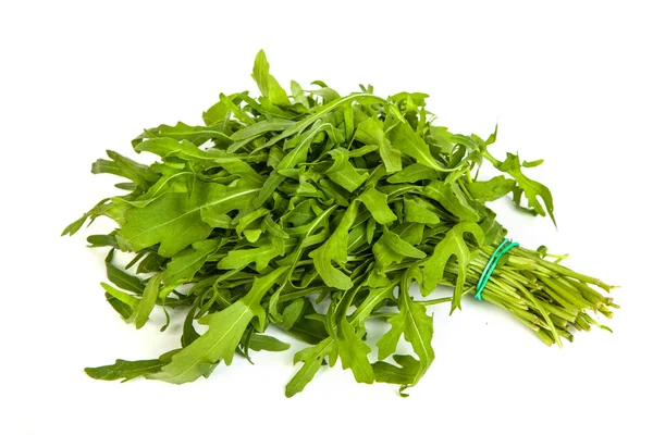 Arugula-rucola foglia di cumulo fresco su bianco — Foto Stock