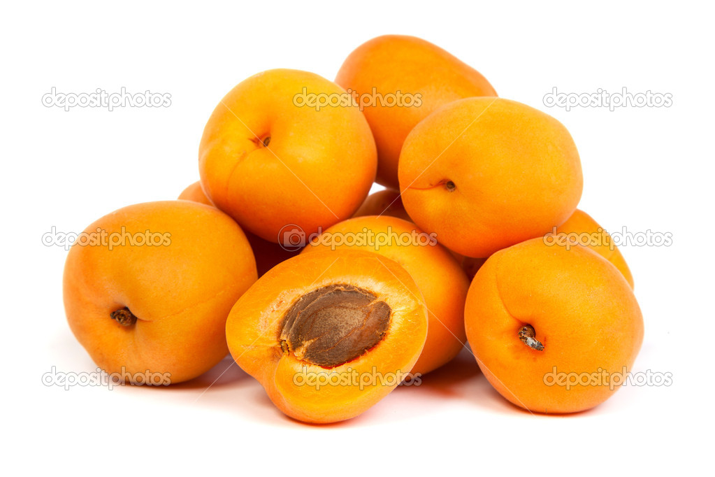Group of ripe apricots with a half